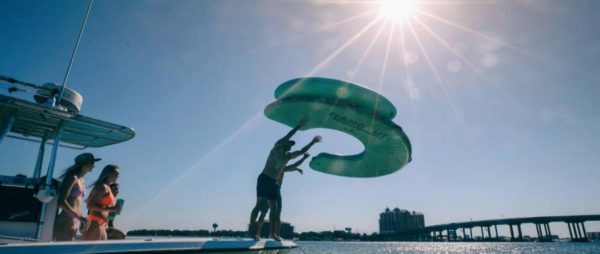 This Giant Curved Inflatable Dock Holds Up To 6 Adults and a Cooler