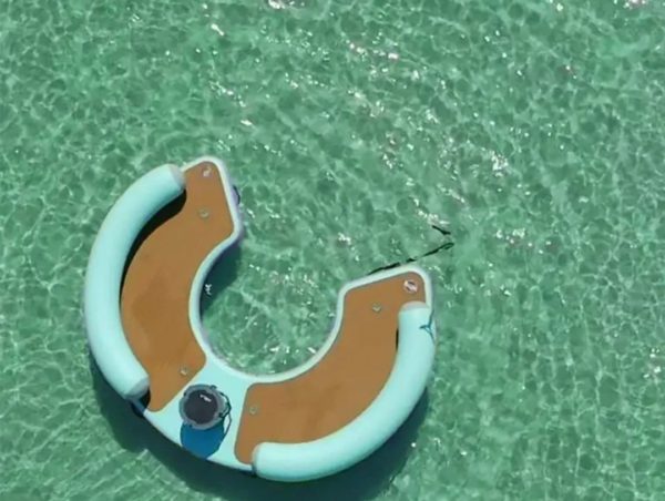 This Giant Curved Inflatable Dock Holds Up To 6 Adults and a Cooler